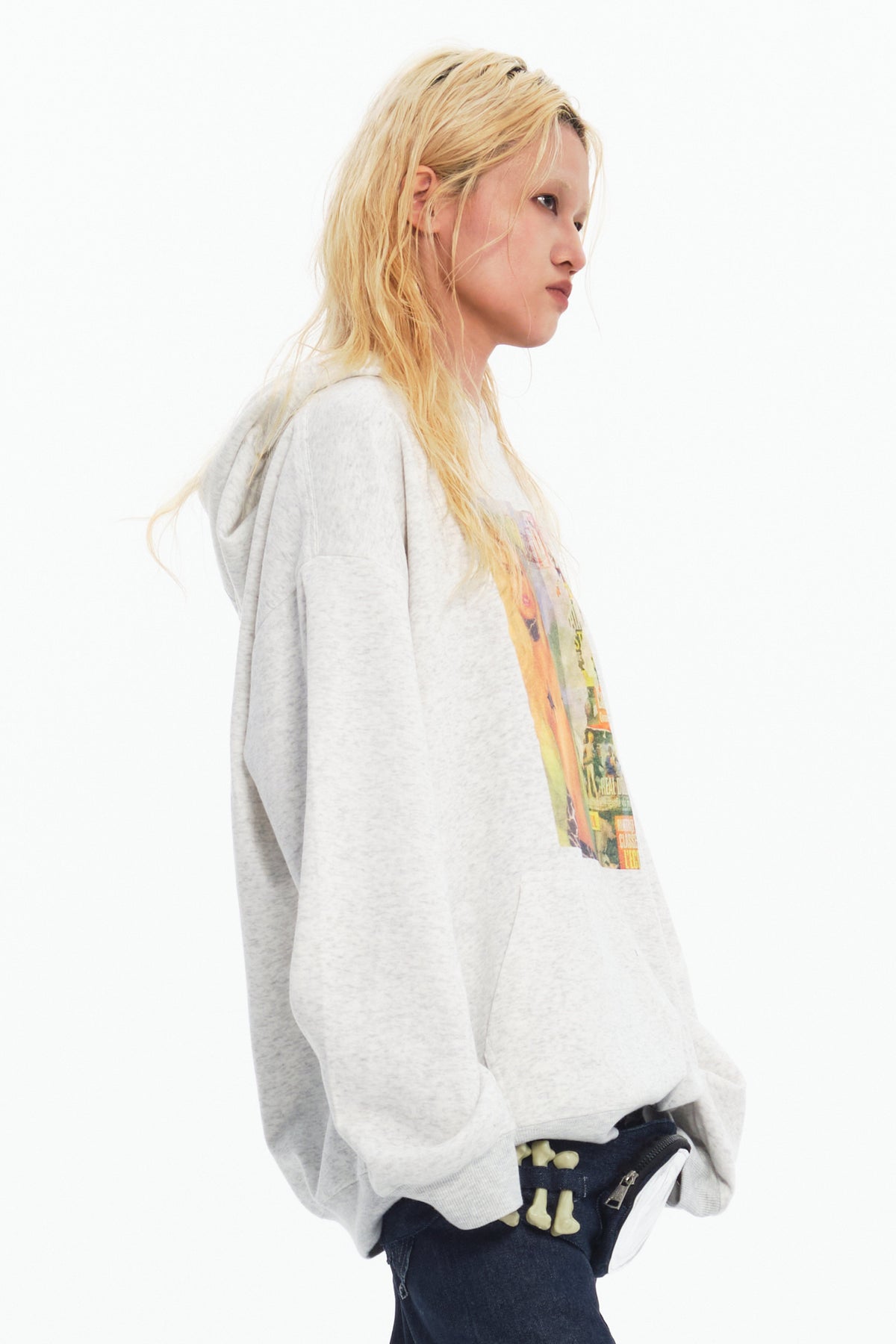 EMBRYO STAR GIRL graphic hoodie in gray — side modeled view showing the relaxed hood and sleeve