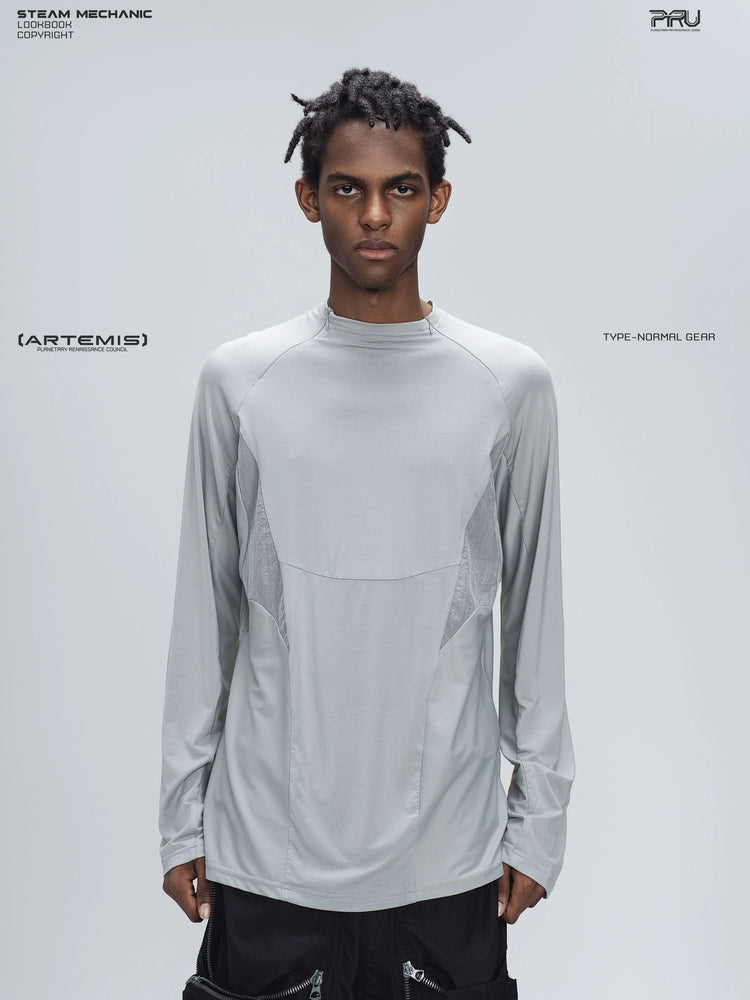 ARTEMIS moon dust gray stretch technical base-layer top — front modeled view showing the curved chest seam and contrasting gray panels
