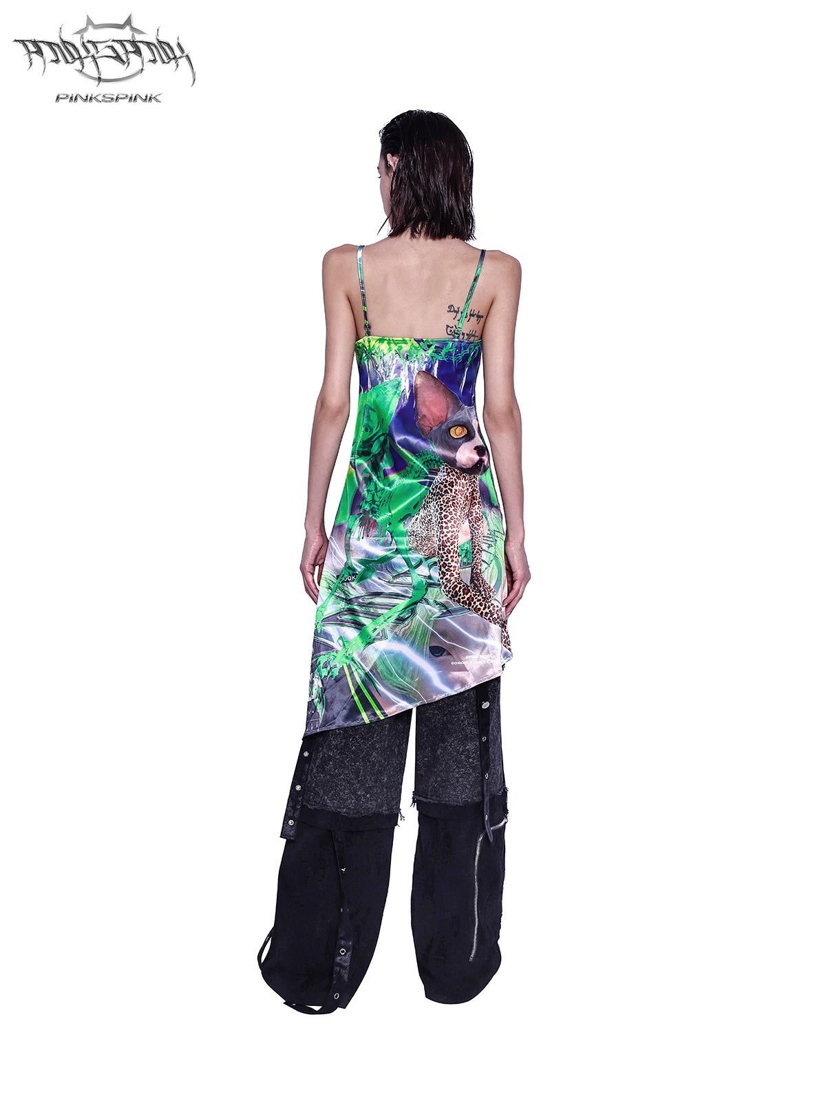 PINKSPINK SPHYNX fluorescent portrait asymmetric dress — rear styling view over separate trousers