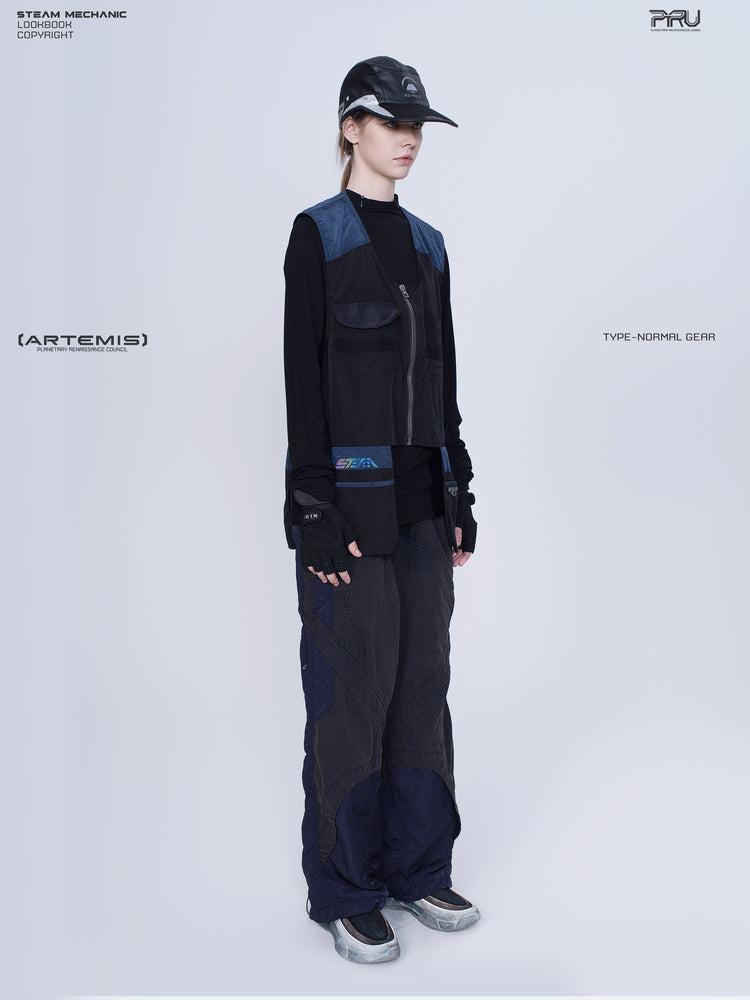 SUPERNOVA zima blue metallic nylon technical pants — full-length modeled opposite-side view showing zip pocket and panel seams