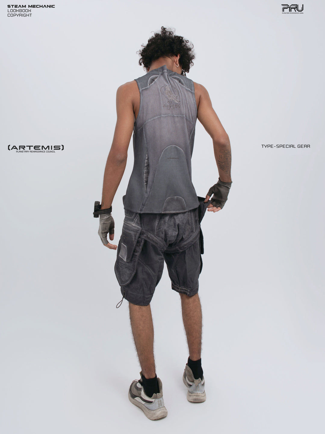 AEGIS stellar blue distressed mesh tank top — three-quarter back modeled view showing the hem and mesh construction
