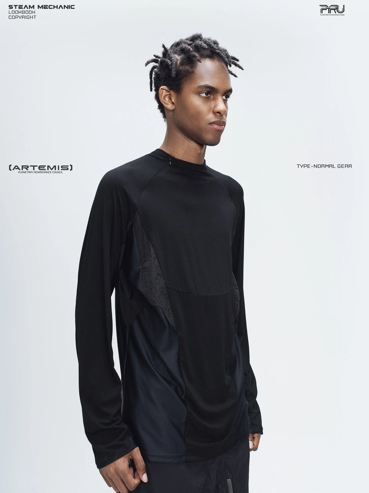 ARTEMIS stardust black stretch technical base-layer top — three-quarter modeled view showing the raglan shoulder and fitted sleeve