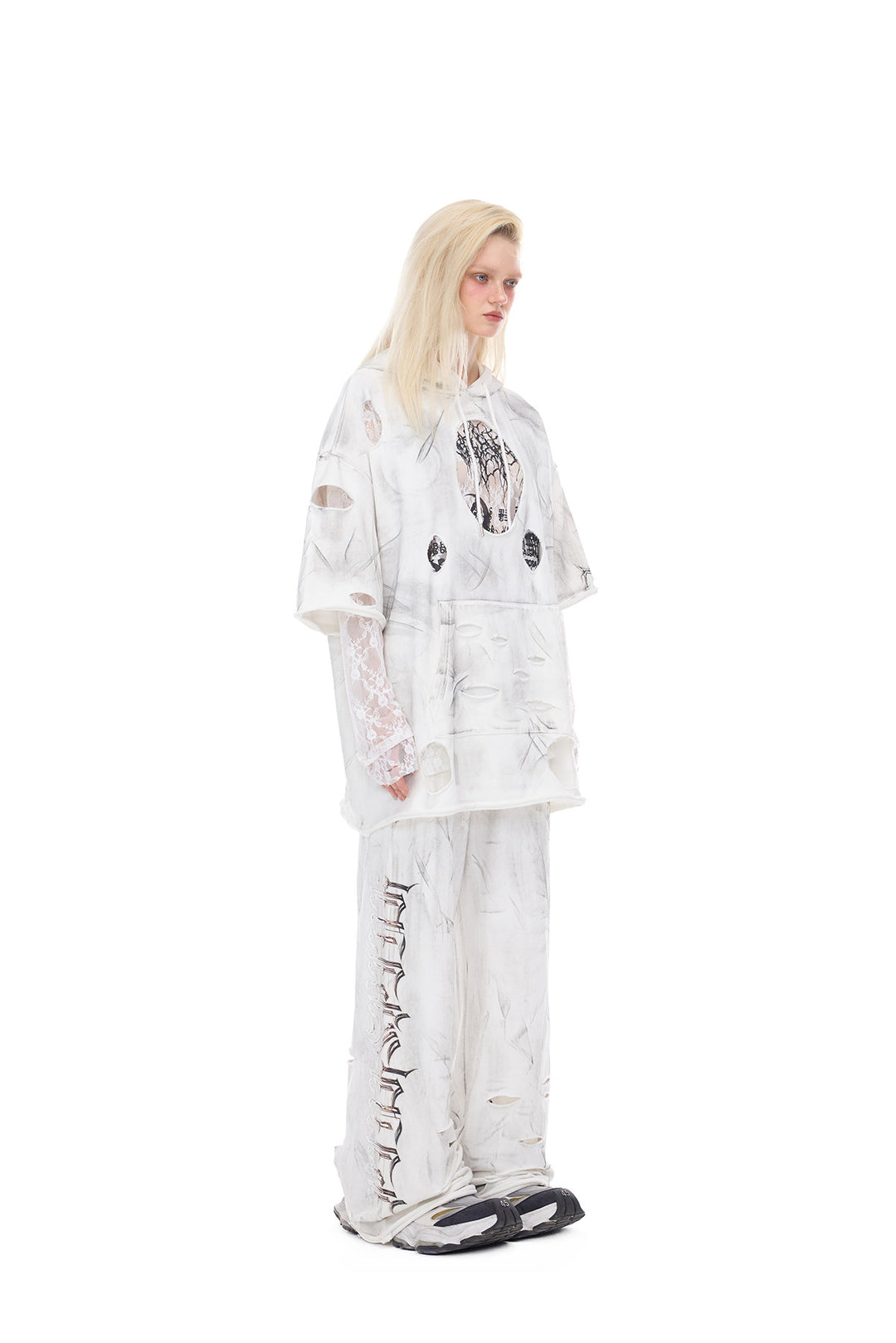 PINKSPINK ELECTRIC MOON coated distressed flare sweatpants — alternate modeled view showing the silhouette