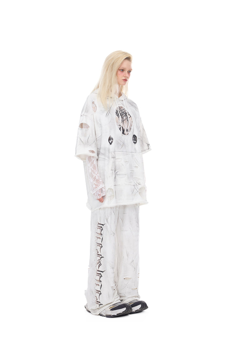 PINKSPINK ELECTRIC MOON coated distressed flare sweatpants — alternate modeled view showing the silhouette