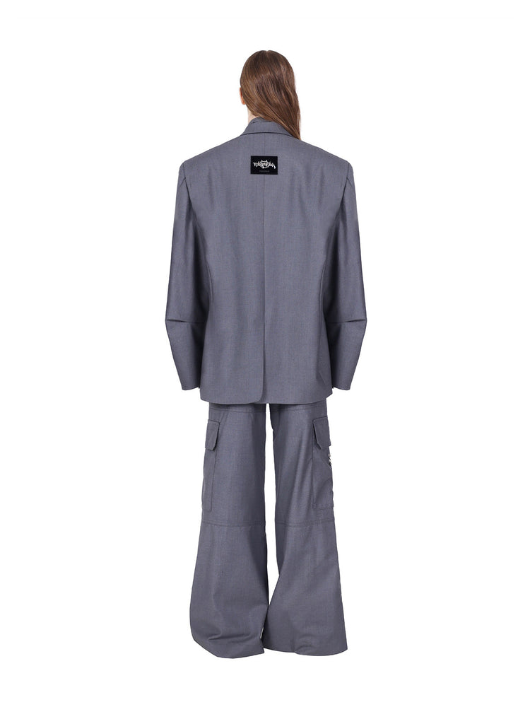 PINKSPINK ELECTRIC MOON ring-detail cargo flare trousers in gray — full-length rear view styled with a separate blazer