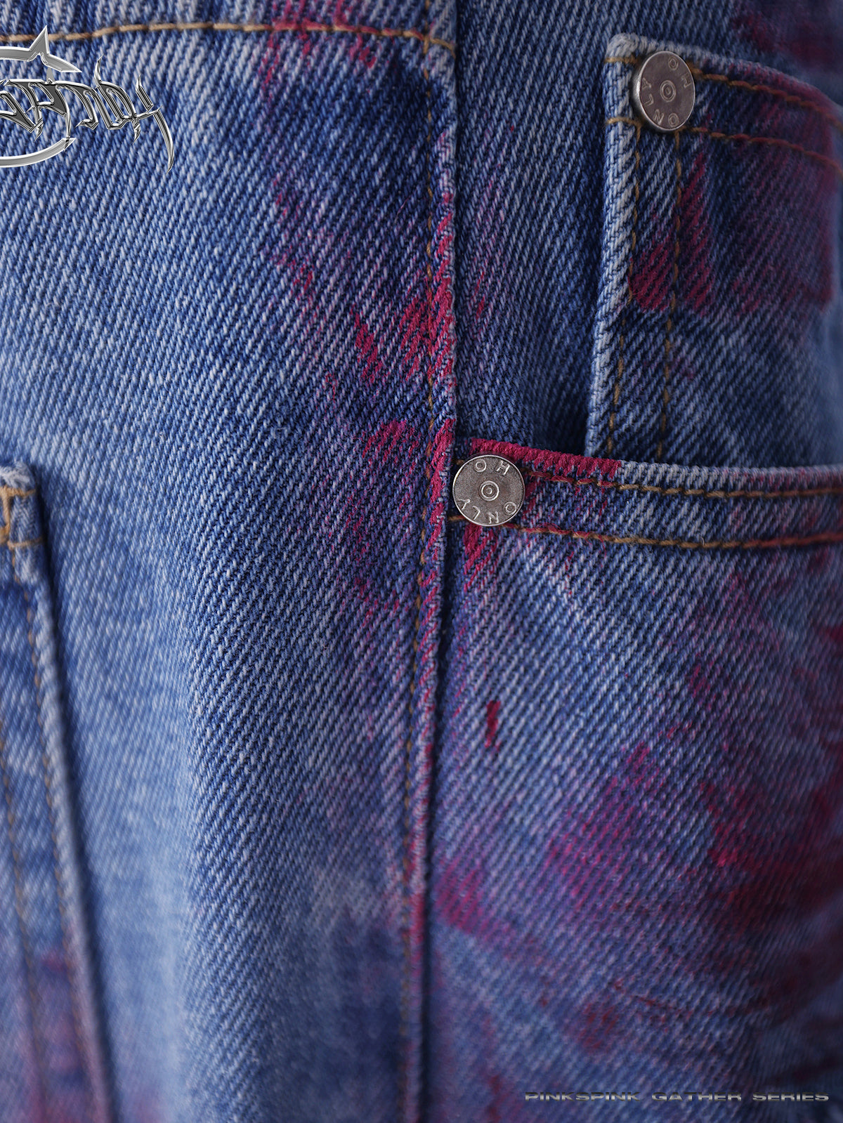 PINKSPINK WASTELAND pink-coated blue jeans — close detail of the pink coating, denim weave and riveted pocket