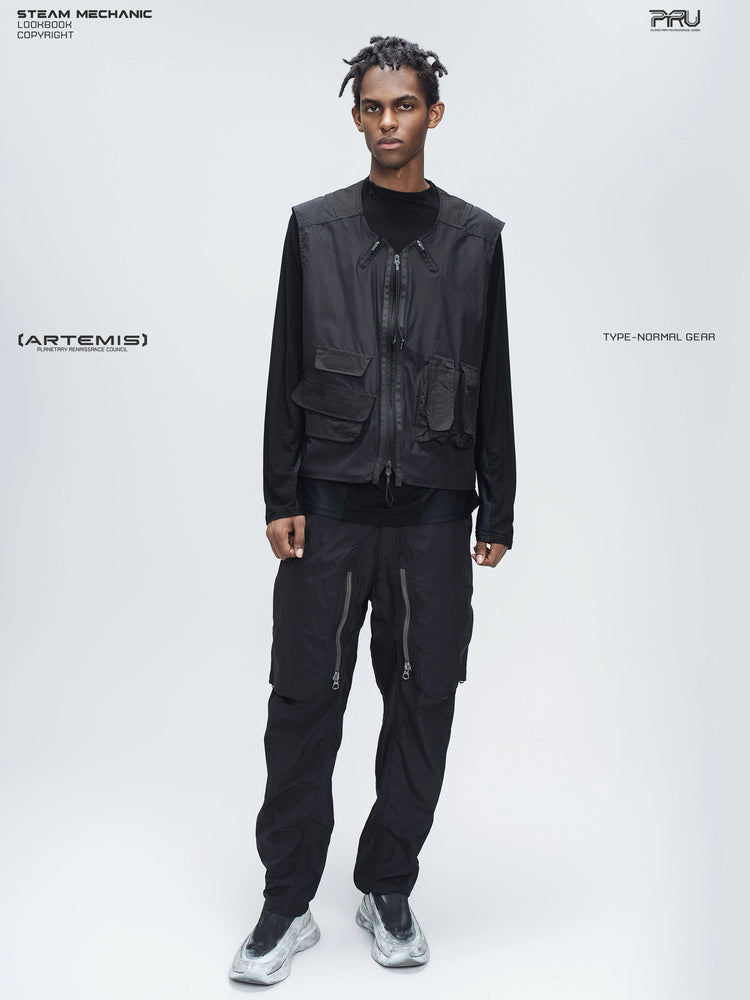 ARTEMIS stardust black stretch technical base-layer top — front full-length styling view with a separate utility vest