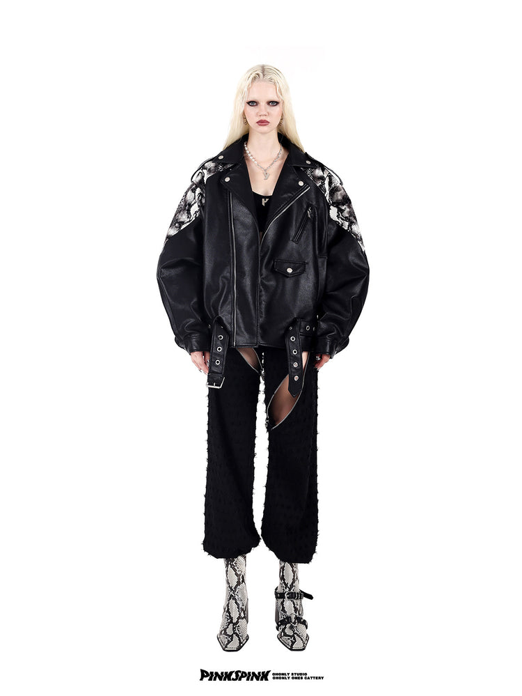 PINKSPINK COBRA snake-print faux-leather moto jacket — black full-length front modeled view styled with distressed cut-out trousers