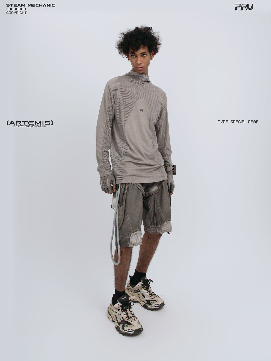 STARCORE mesh-panel long-sleeve top in dusk cloud gray — full-length front modeled view with one hand in pocket