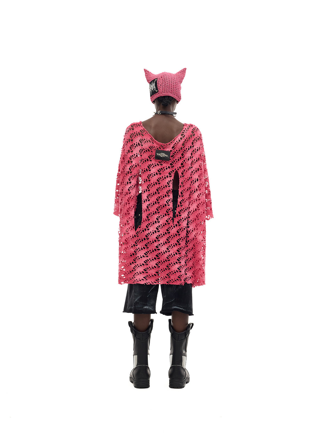 PINKSPINK ELECTRIC MOON distressed open-knit oversized tee in pink — full-length back modeled view with a cat-ear beanie