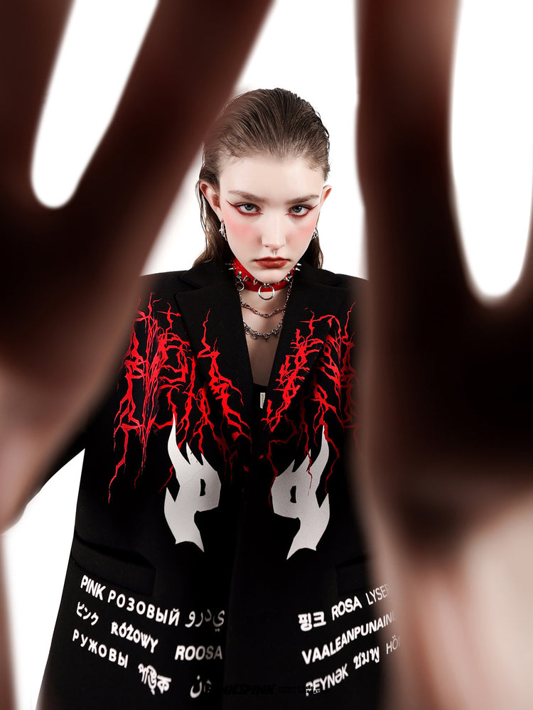 PINKSPINK SPIKE RING studded chain choker in red — front editorial modeled close-up with hands in the foreground