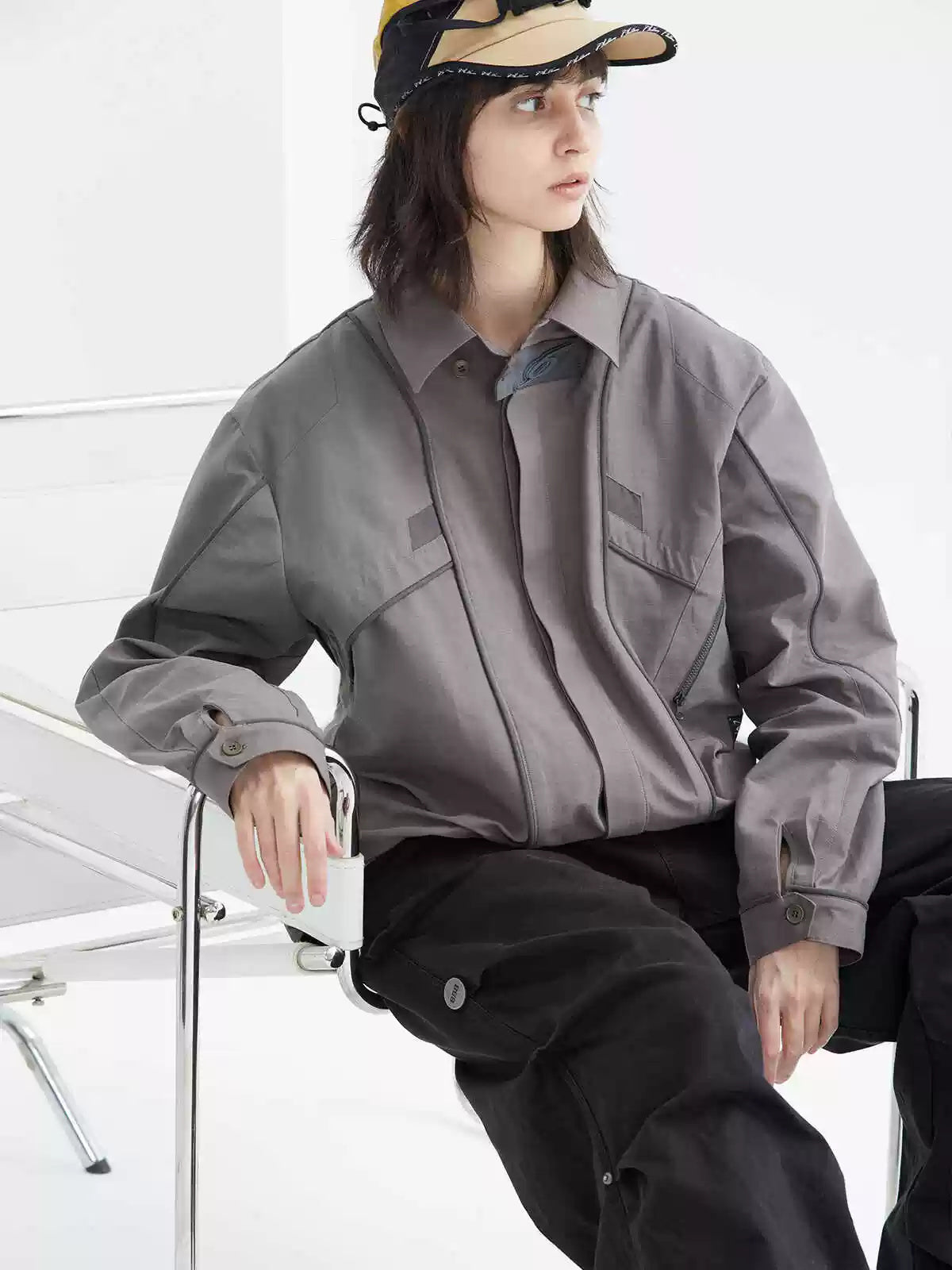 ERRORCODE ROBOT taupe tech work shirt — seated modeled view looking to the side; source gallery image 4