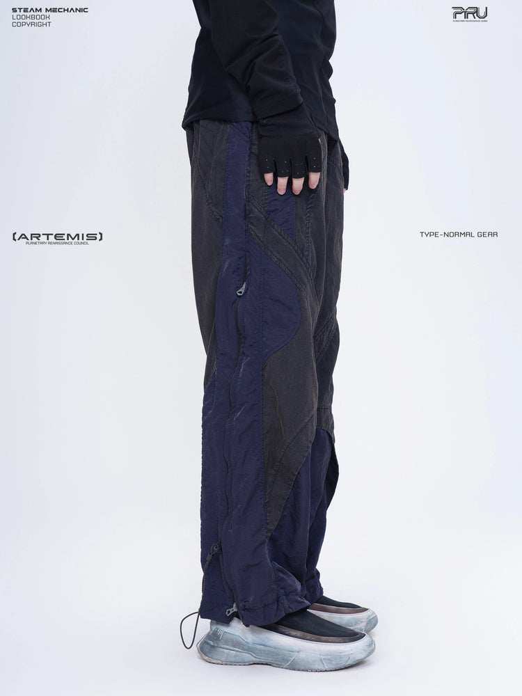SUPERNOVA zima blue metallic nylon technical pants — opposite-side modeled close-up