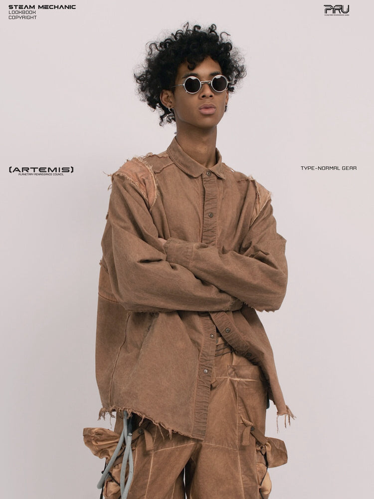 CHAOS ERA raw-edge technical shirt in soft dawn orange — front modeled close-up with arms crossed