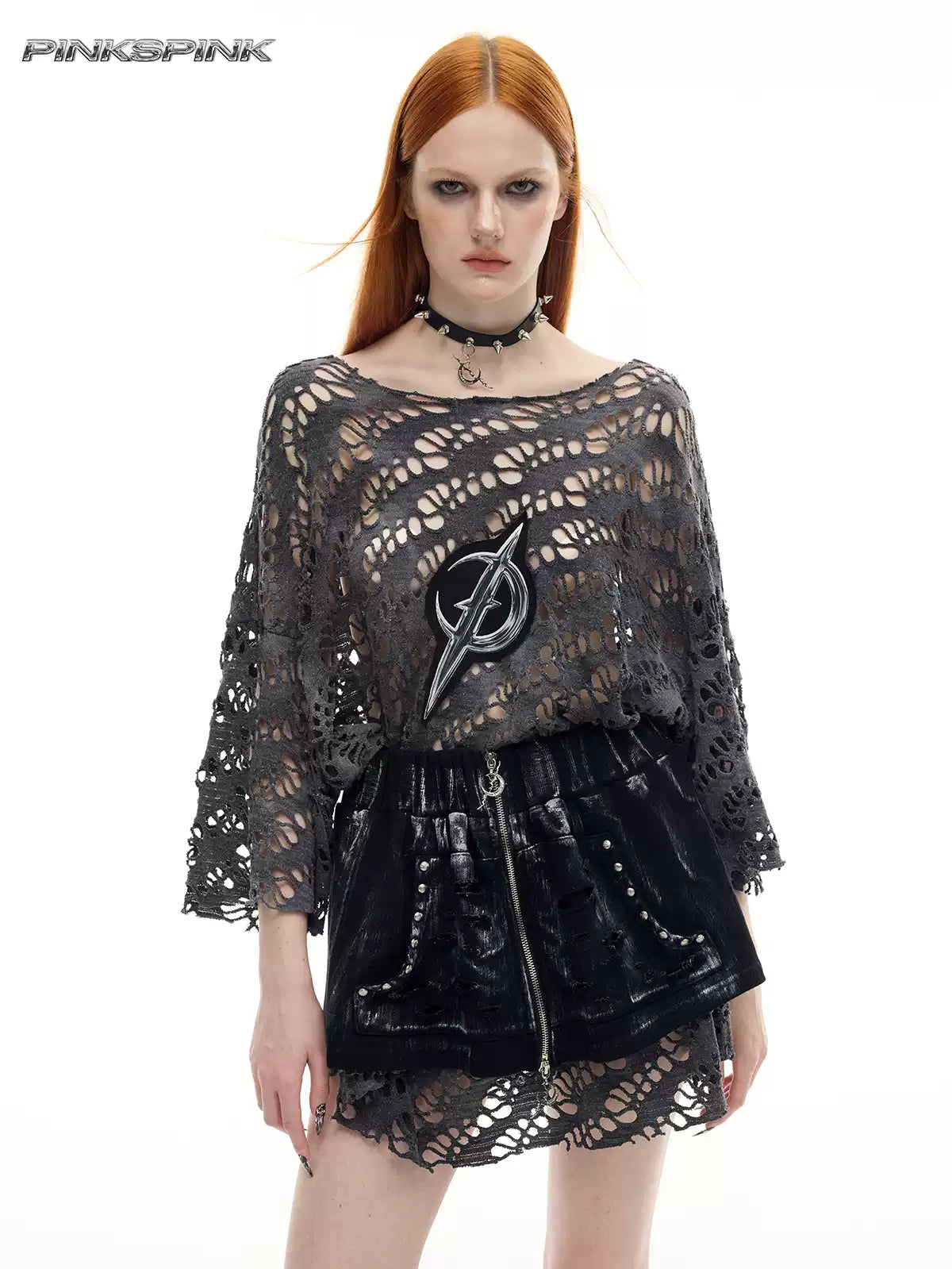 PINKSPINK ELECTRIC MOON coated zip-front mini skirt in black — front close-up showing the studded pockets and zip, styled over a mesh layer