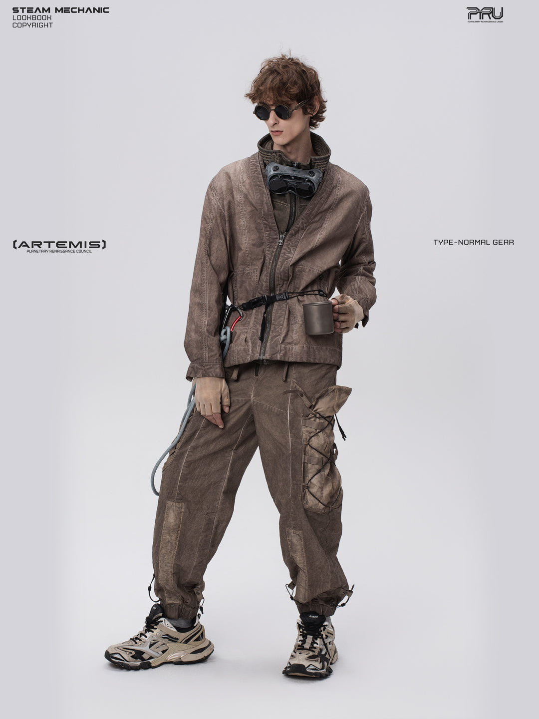 GAIA ochre brown open-collar technical robe — full-length front view holding a cup at the waist