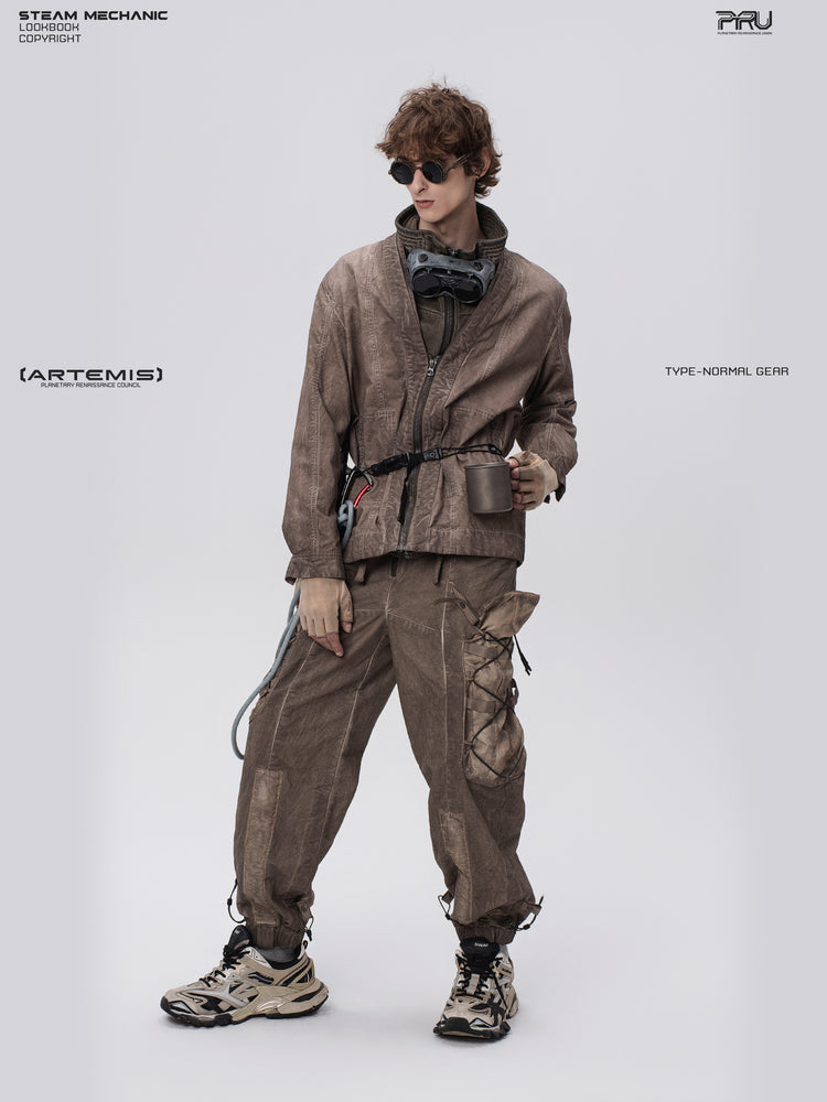 GAIA ochre brown open-collar technical robe — full-length front view holding a cup at the waist