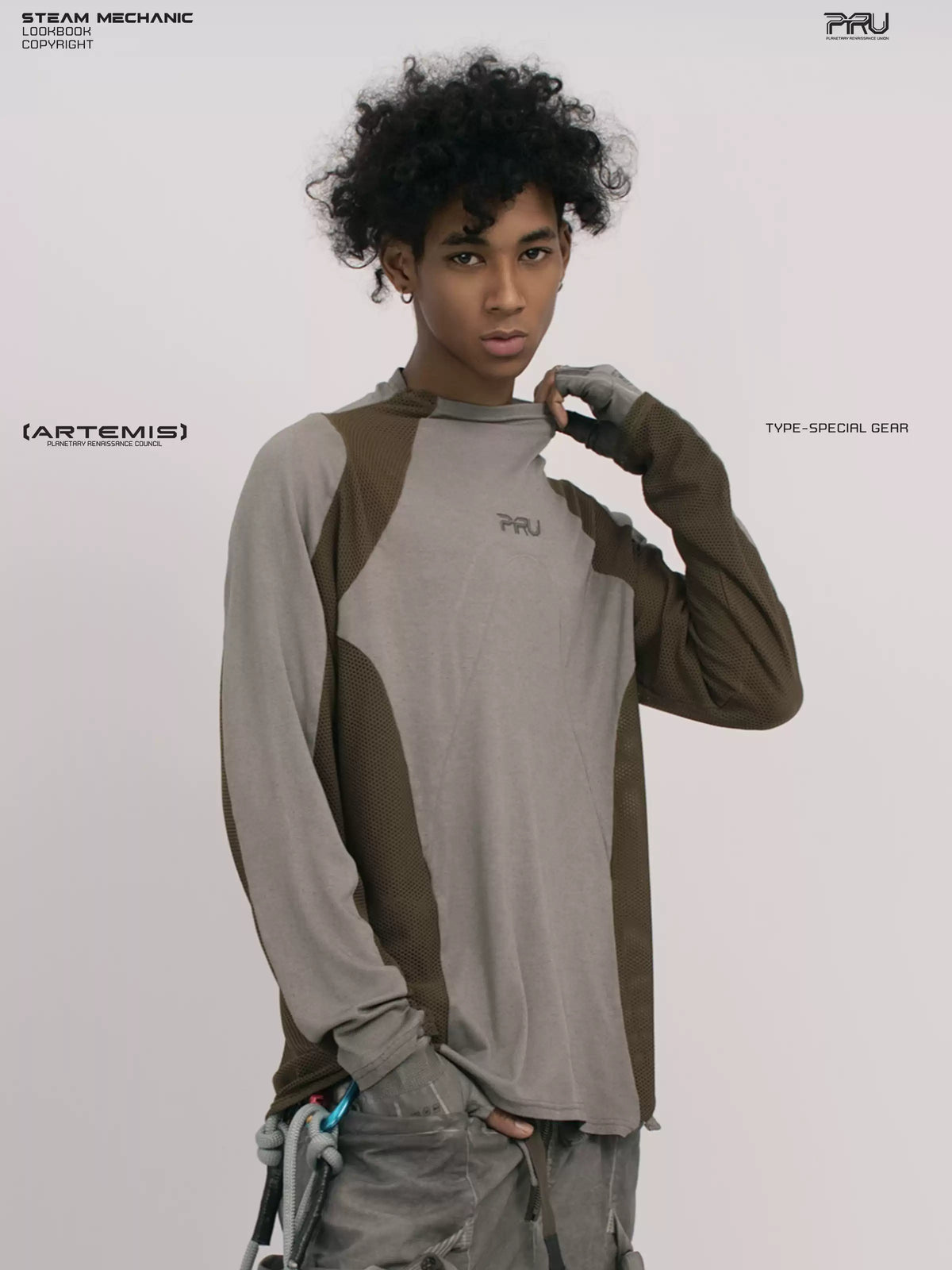 STARCORE ash tundra mesh-panel long-sleeve top b — front modeled close-up with hand at collar