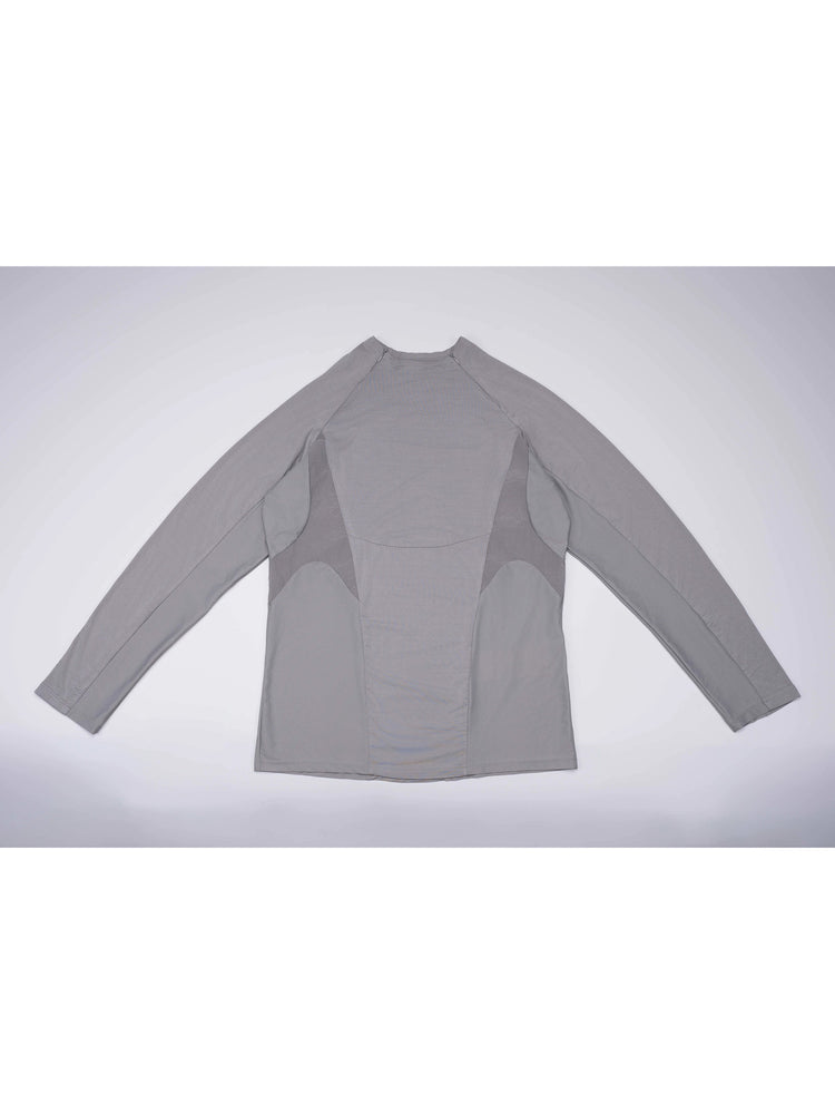 ARTEMIS moon dust gray stretch technical base-layer top — moon dust gray front flat lay showing curved contrast panels