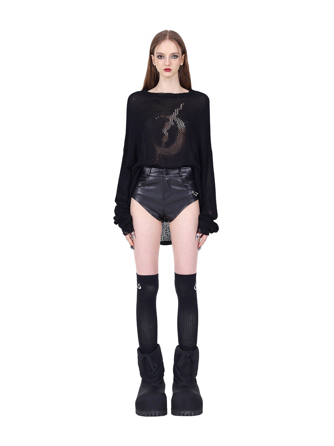 PINKSPINK ELECTRIC MOON distressed open-knit sweater in black — straight-on tucked front view with sleeves gathered above separate shorts