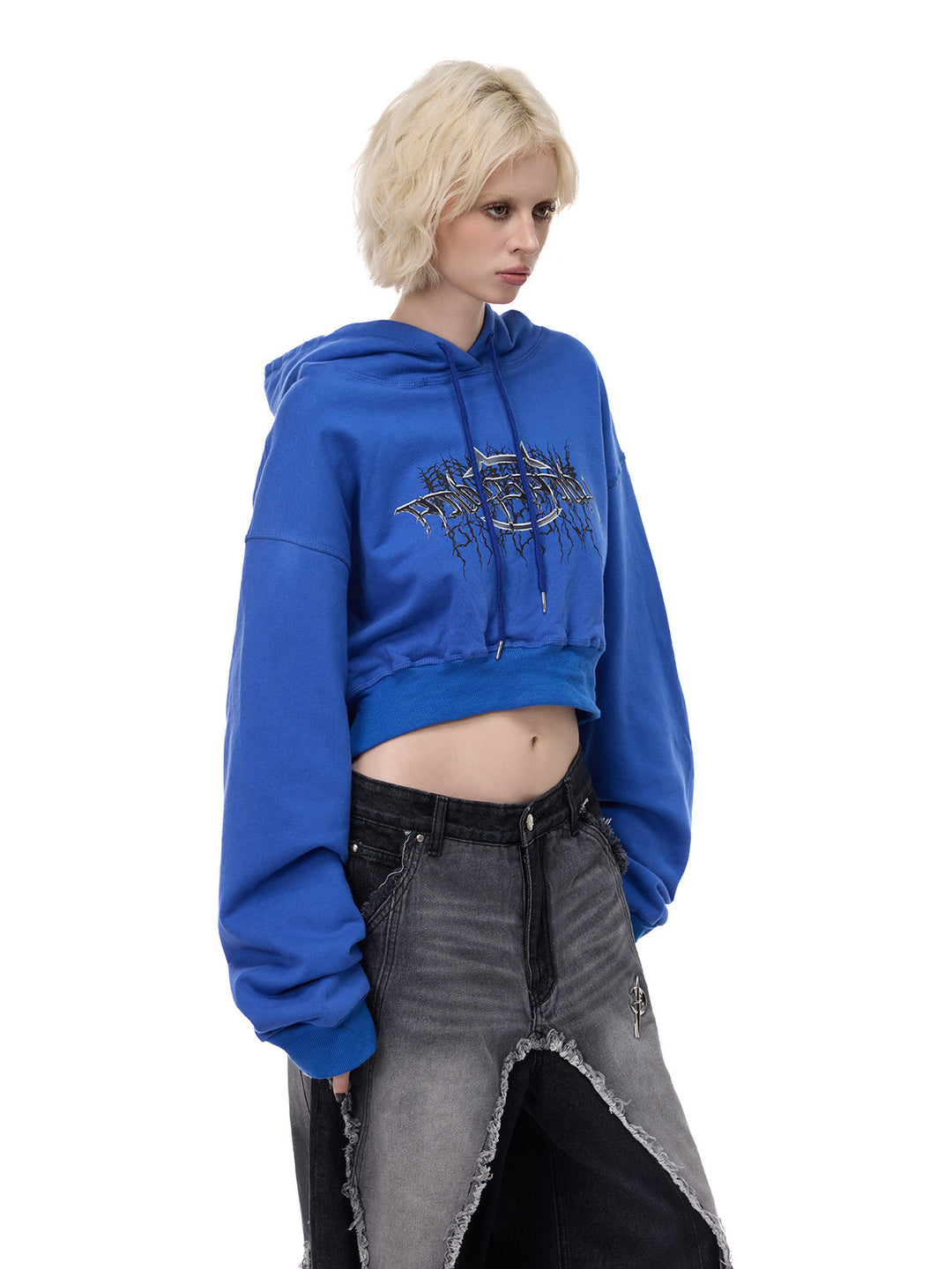 PINKSPINK THORN SIGNAL open-back cropped hoodie — Klein blue three-quarter modeled view