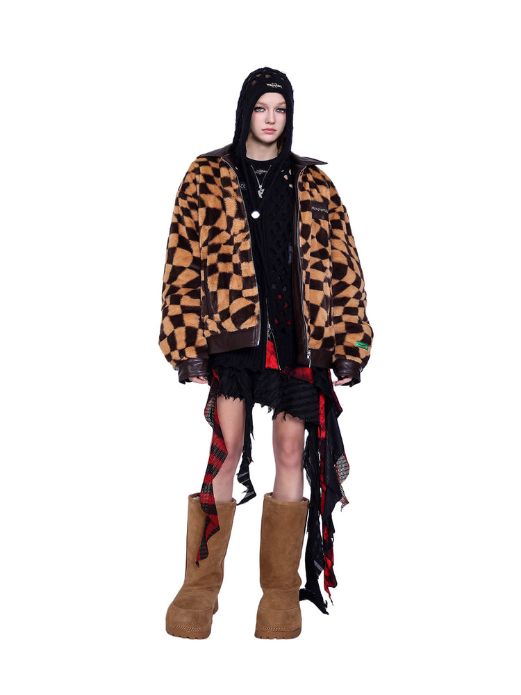 PINKSPINK WARPED checkerboard padded faux-fur jacket — caramel brown checkerboard jacket — front view layered over a black hood
