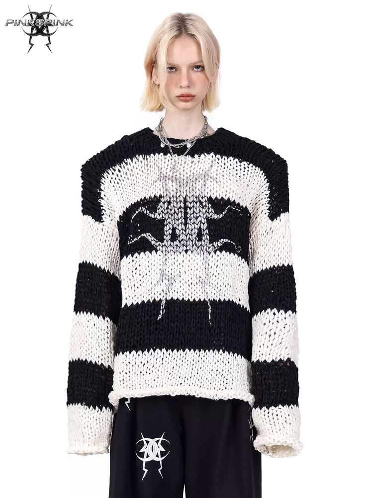 PINKSPINK MIRROR striped open-knit padded-shoulder sweater in black white stripes — front modeled close-up showing wide stripes and mirrored-moon artwork
