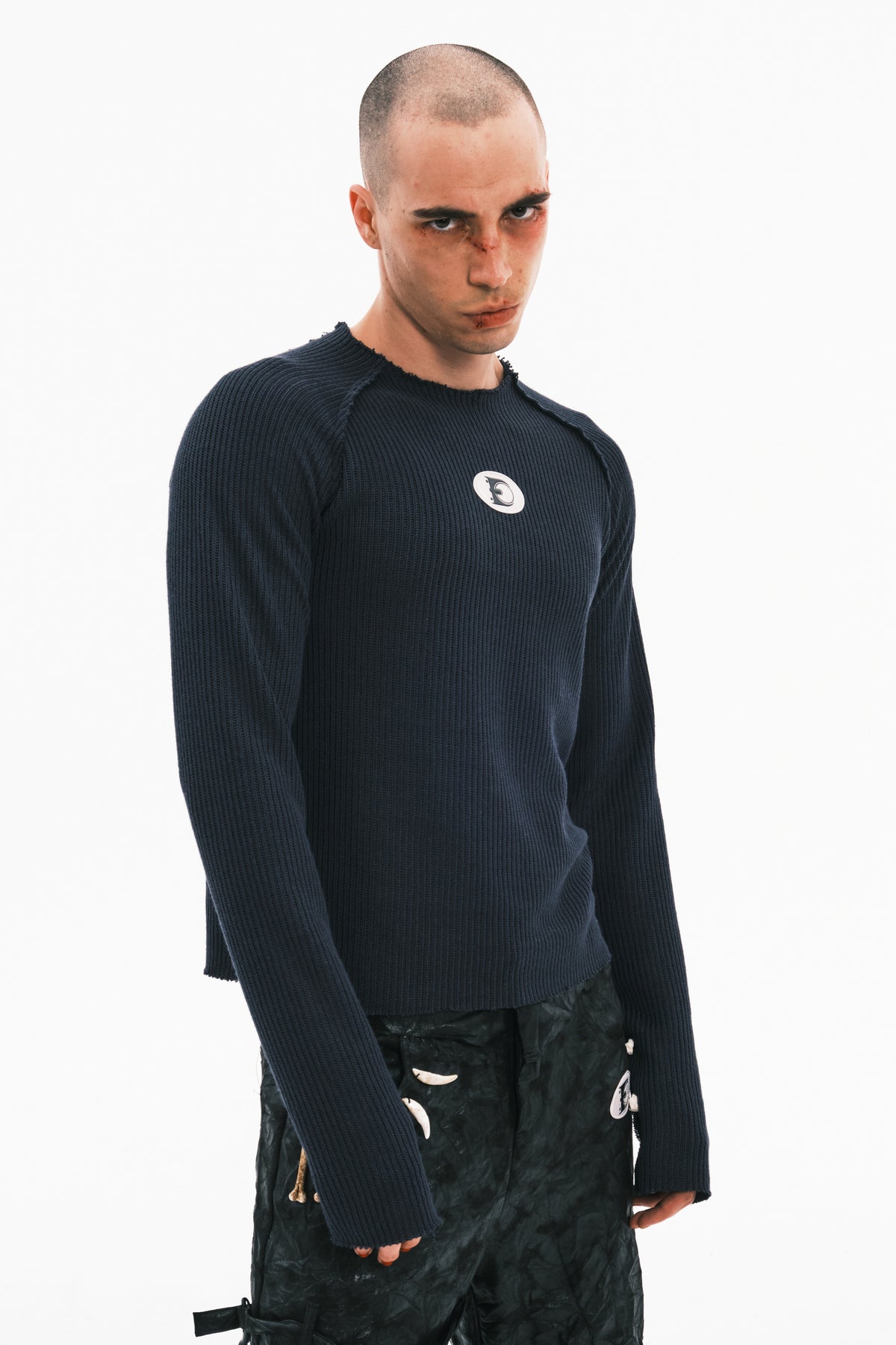 EMBRYO BONEWORK hand-knit sweater in navy — front modeled portrait showing the crew neck and long sleeves