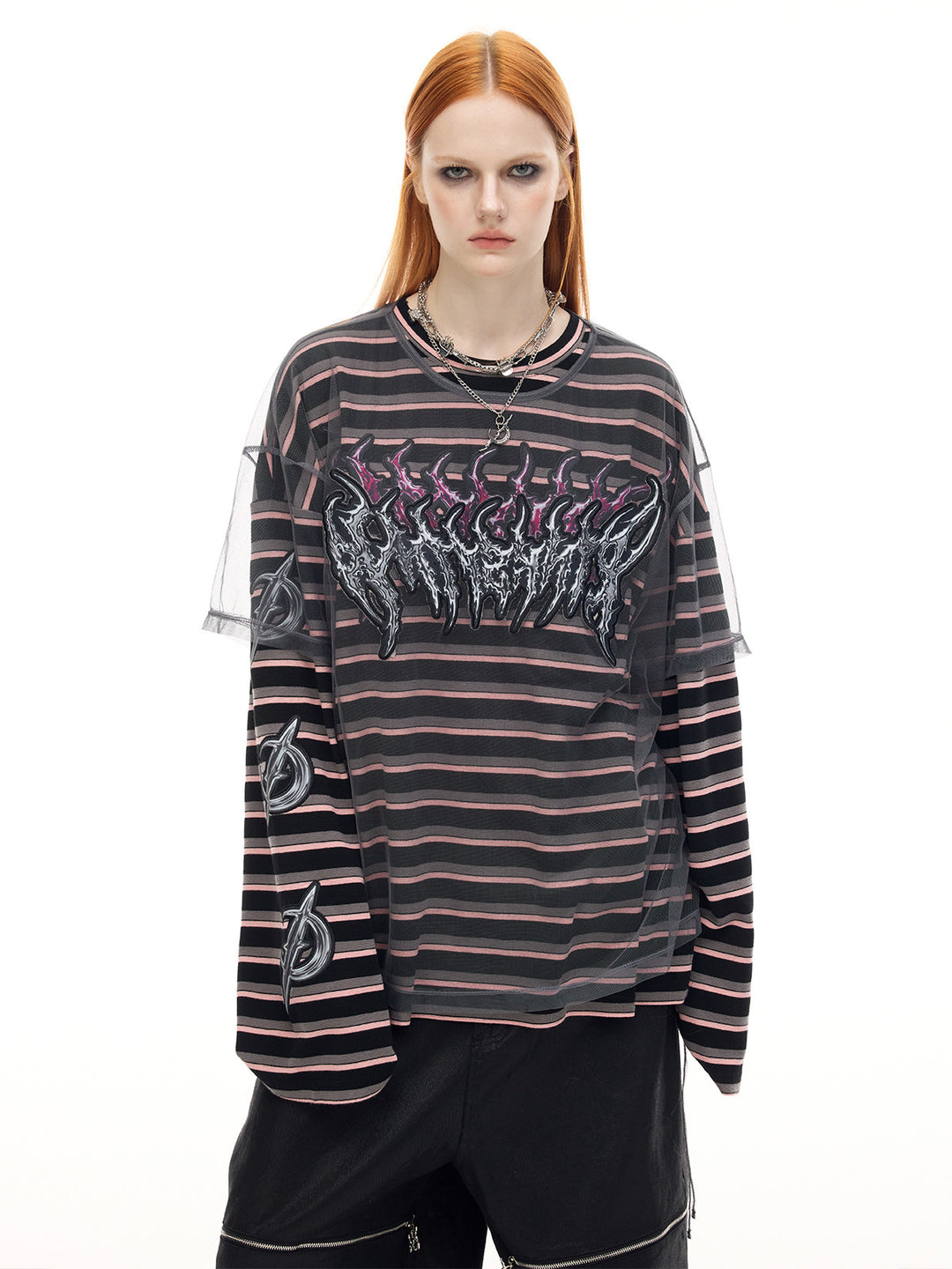 PINKSPINK ELECTRIC MOON striped mesh-overlay two-piece tee in black pink — front modeled close-up corresponding to the hero collage