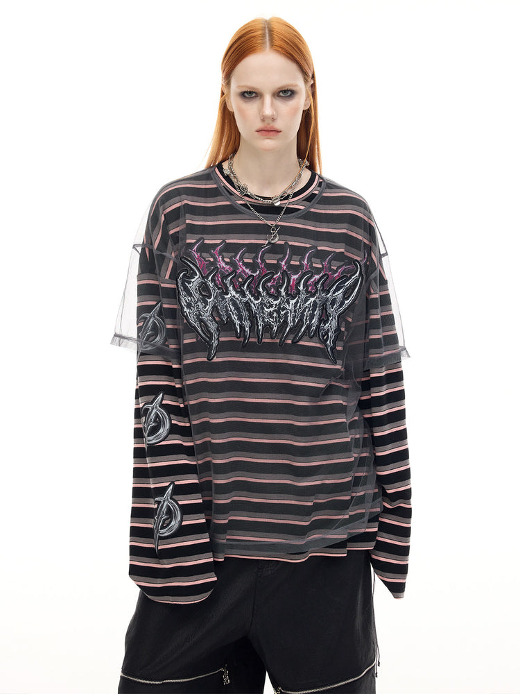 PINKSPINK ELECTRIC MOON striped mesh-overlay two-piece tee in black pink — front modeled close-up corresponding to the hero collage