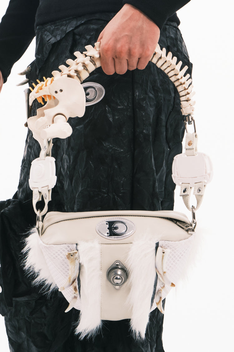 EMBRYO SPINE FRAME bone-handle leather bag — full-length modeled view
