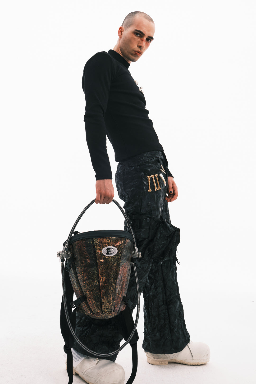 EMBRYO ORACLE embossed backpack — material and hardware detail