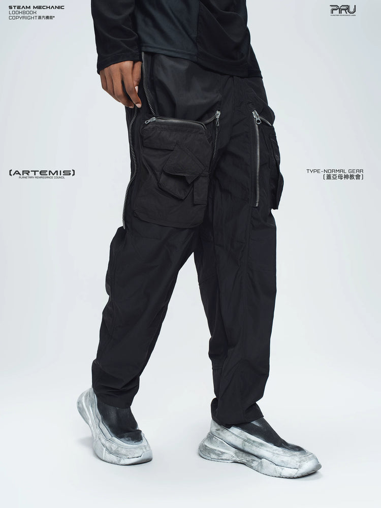 GAIA stone green curved-blade technical pants — full-length styled view