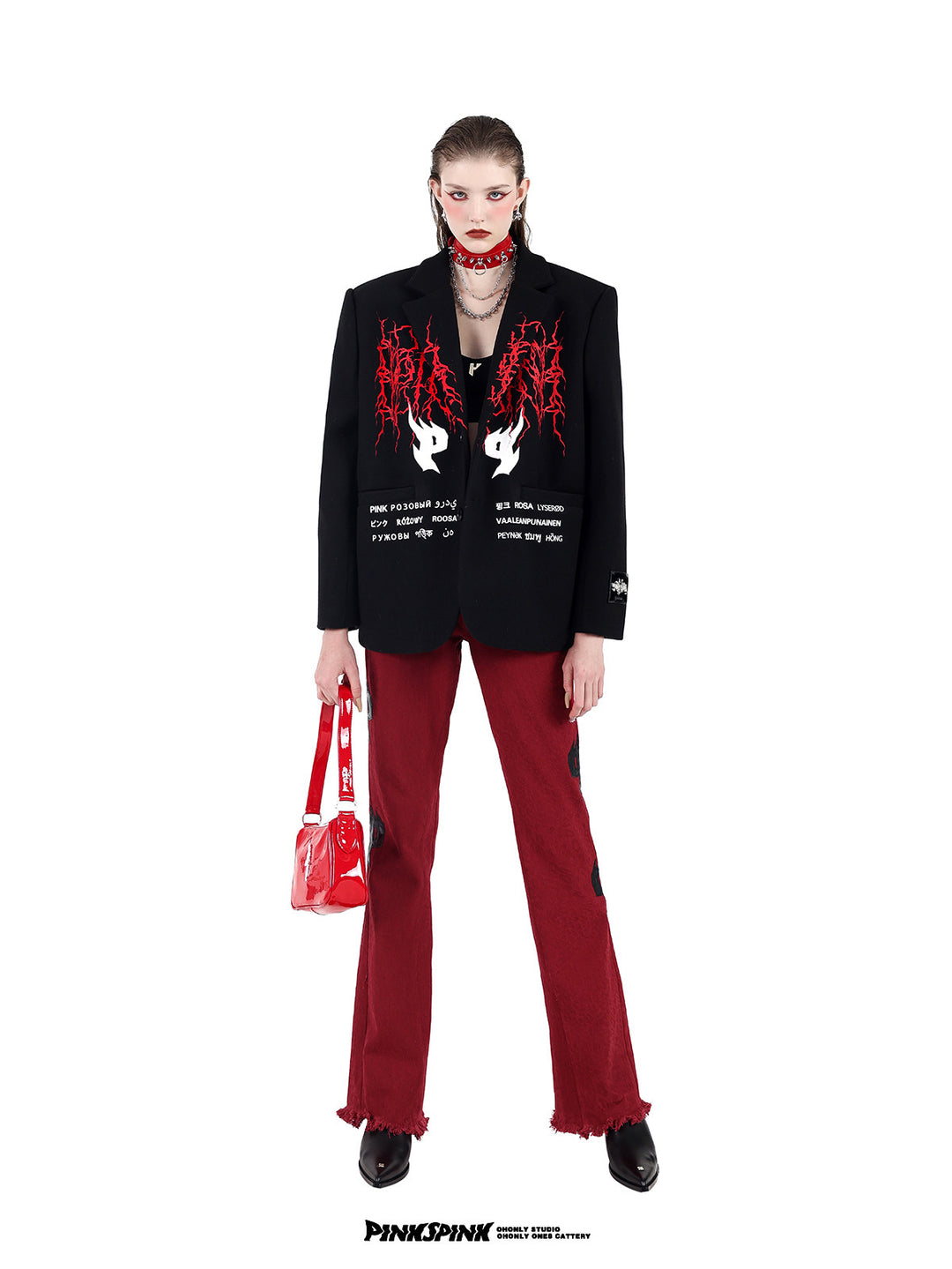 PINKSPINK SPIKE RING studded chain choker in red — alternate full-length front modeled view with a black embroidered blazer