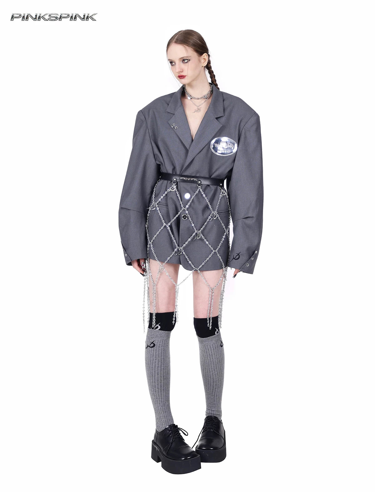 PINKSPINK REBEL pierced oversized tailored blazer in gray — full angled modeled view styled with a chain belt at the waist