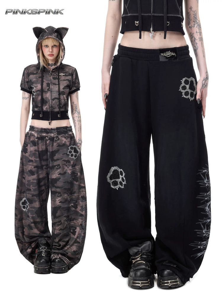 PINKSPINK CATPAW rhinestone curved-leg sweatpants in black and gray-brown camouflage — collage of full-length camouflage styling and a close front view of the black pants