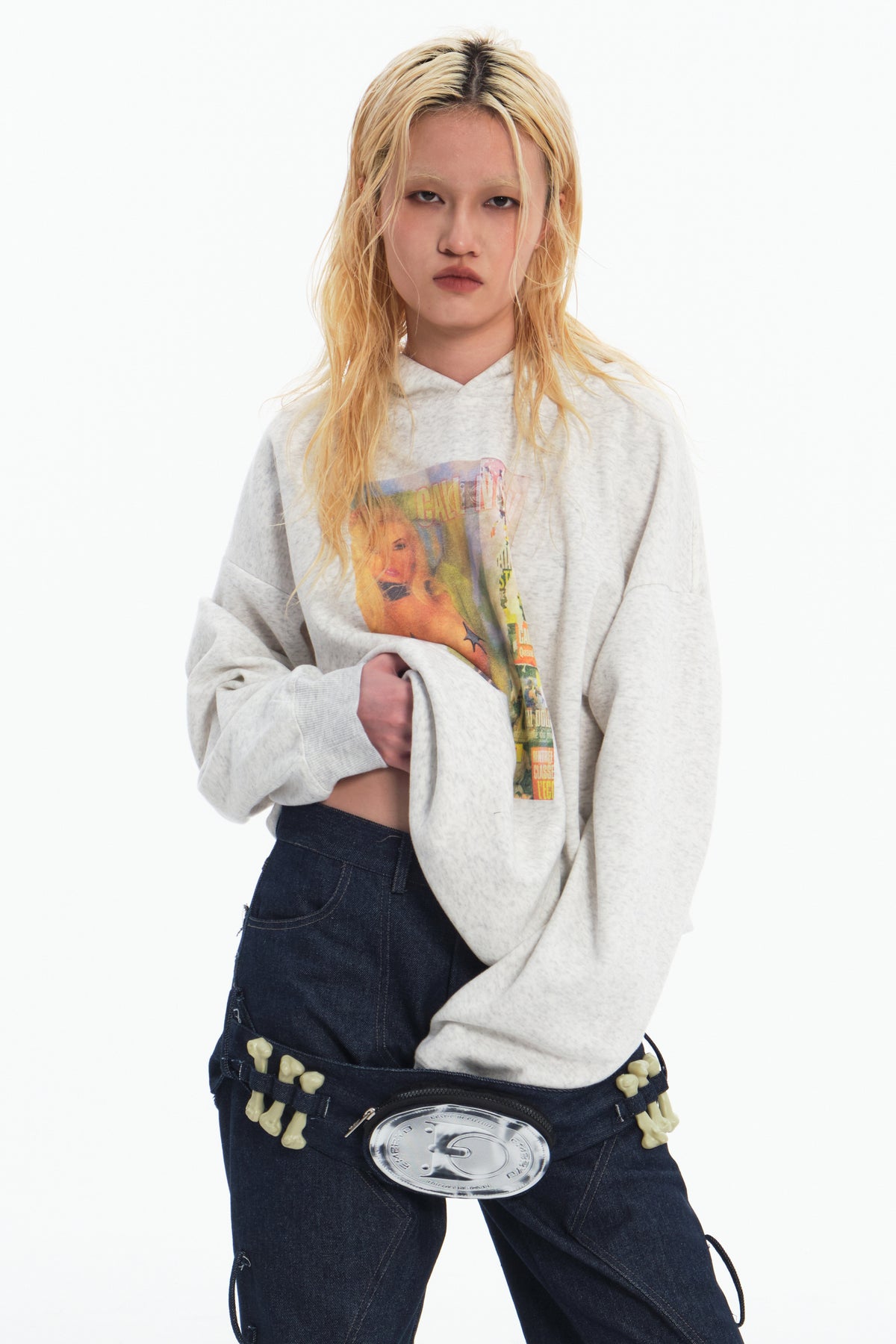 EMBRYO STAR GIRL graphic hoodie in gray — front modeled view with the hem lifted