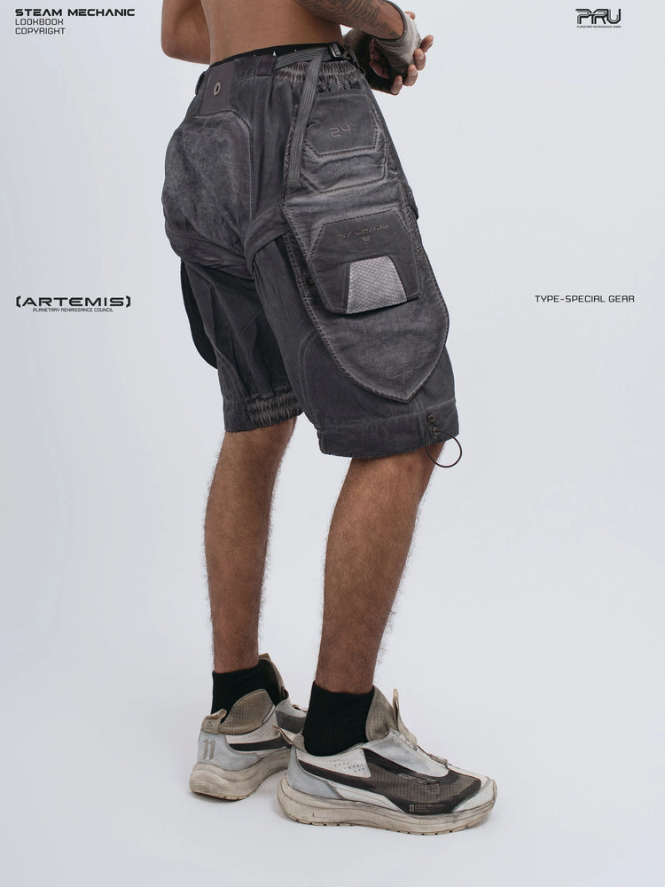 ARTEMIS stellar blue detachable technical shorts — rear three-quarter view with hands clasped behind
