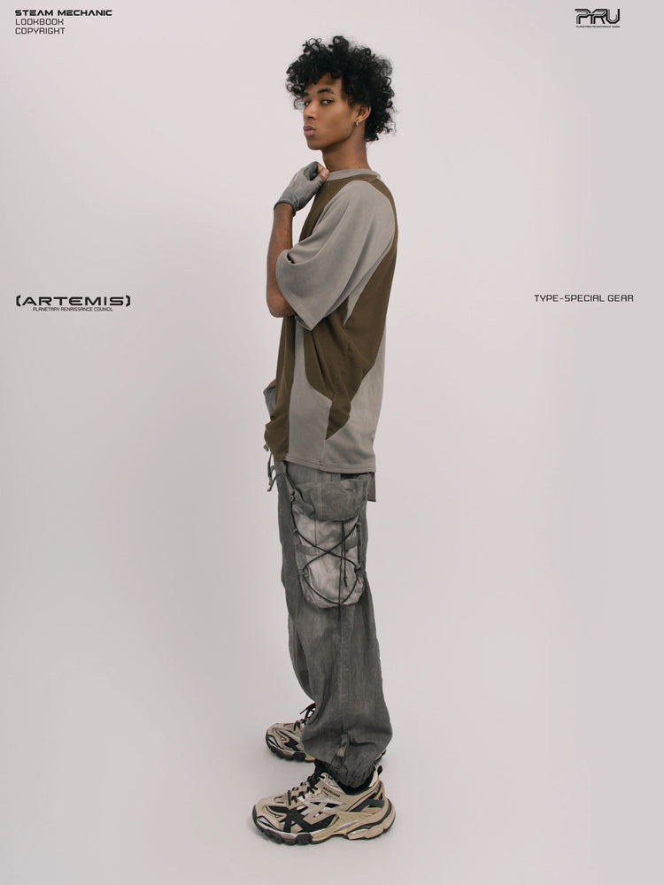 STARFIELD WELDER steel tundra distressed mesh tee — full-length side view with a hand at the neck