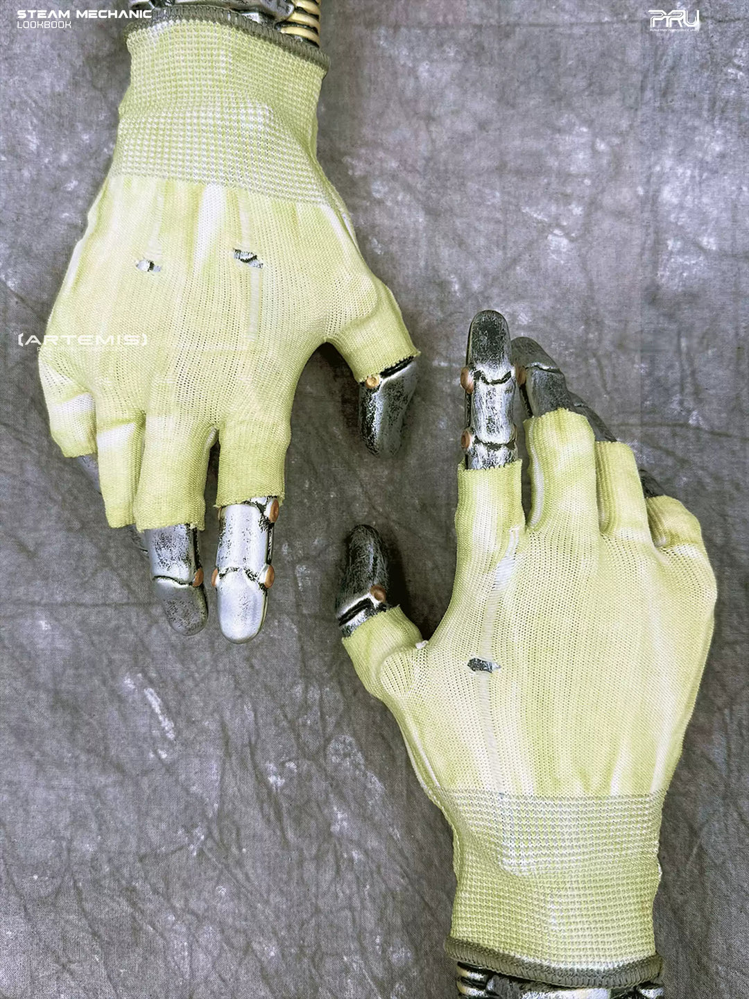 PRECISION CASTING distressed fingerless gloves in nebula green — overhead product view on display hands, showing uncoated distressed knit backs