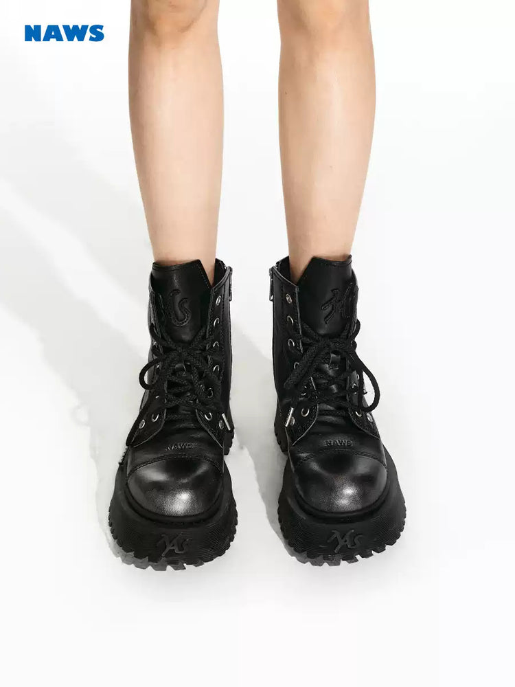 NAWS KNIGHT leather platform lace-up boots in SEA NIGHT BLACK — front modeled view showing round toes and lacing.