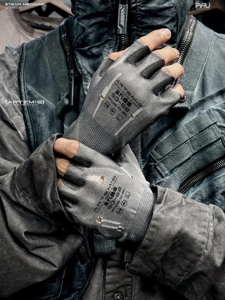 PRECISION CASTING distressed fingerless gloves in moon-dust gray — modeled close-up with hands crossed over the chest, showing distressed knit and printed backs