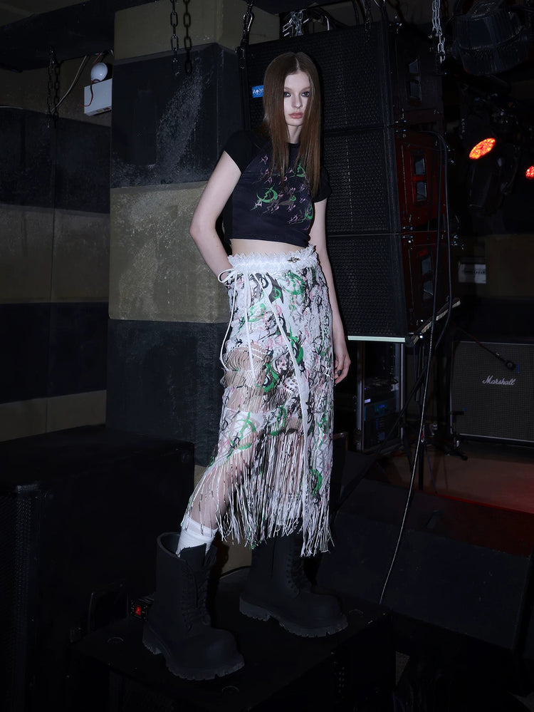 PINKSPINK SHRED SIGNAL printed fringe layering apron — white multicolor — angled modeled view of the printed fringe