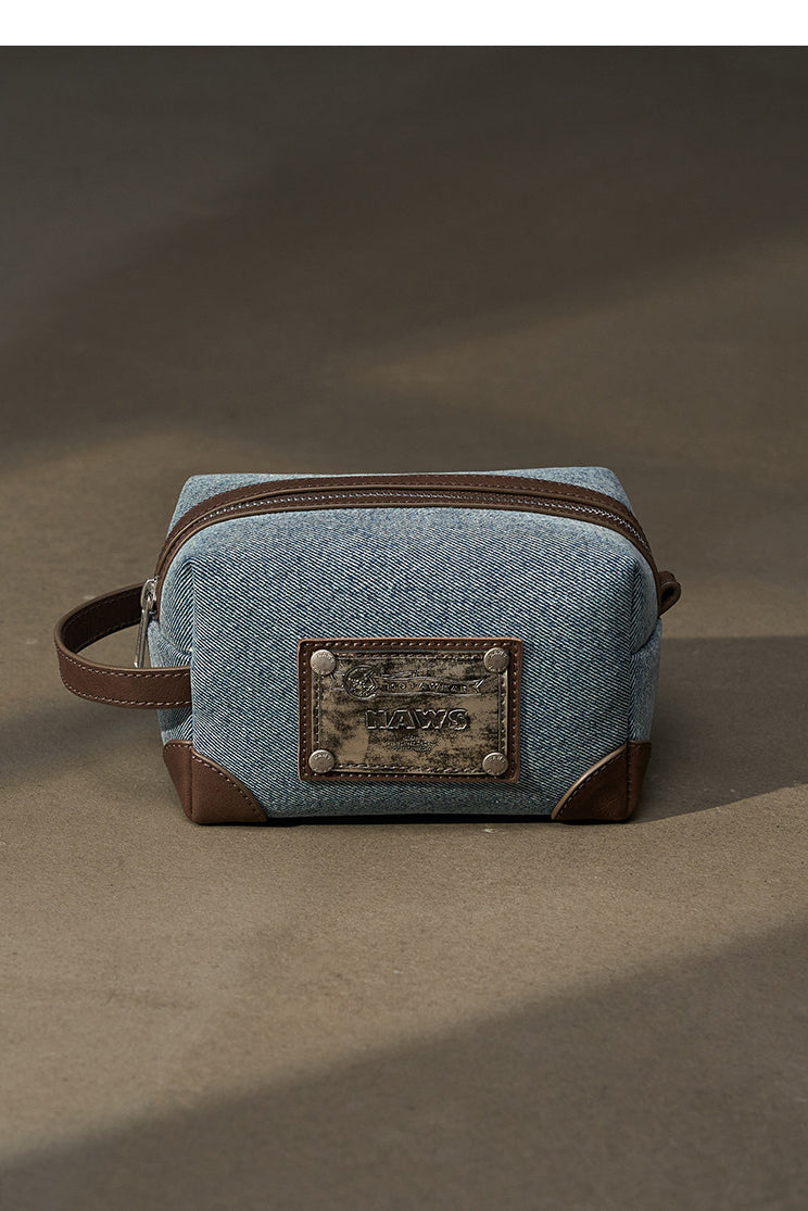 NAWS BLUE BOX denim makeup bag — alternate angle showing the shape and finish