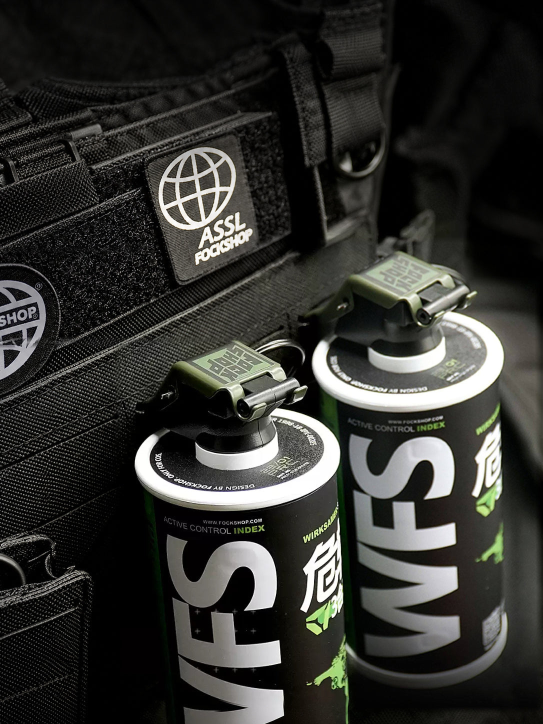 FOCKSHOP REBORN reactor canister prop — angled rear view of two green canisters showing WFS lettering and top fittings