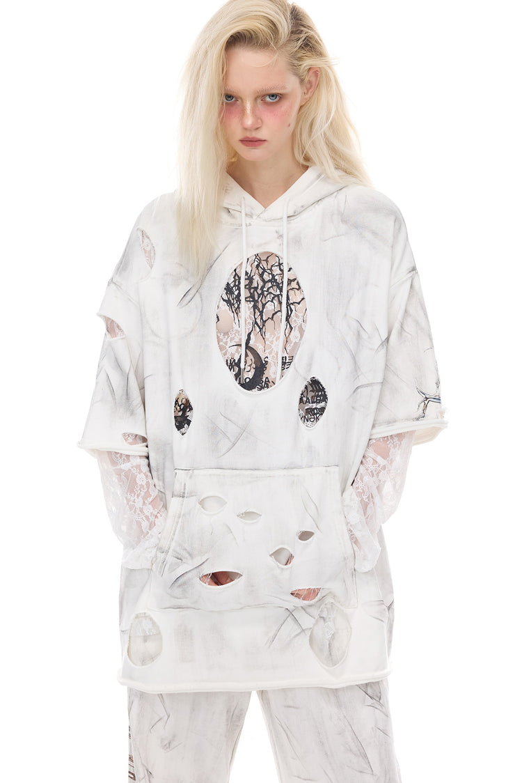 PINKSPINK ELECTRIC MOON coated distressed hoodie — modeled detail view of the garment construction