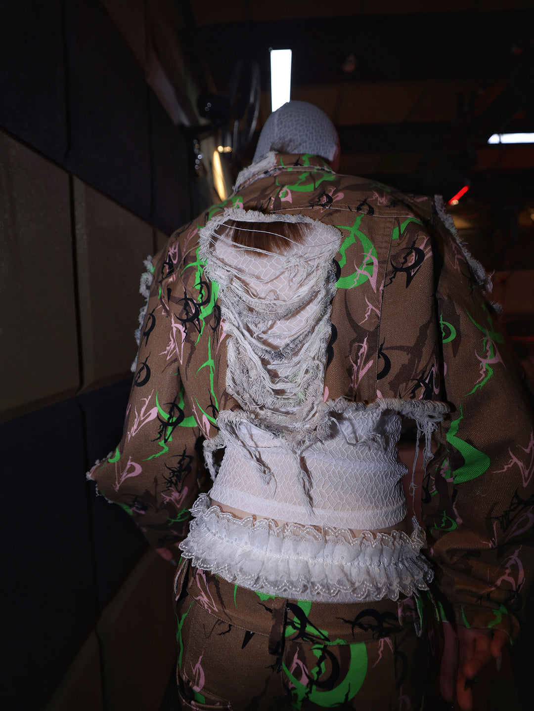 PINKSPINK ELECTRIC MOON distressed camo cropped jacket in CAMOUFLAGE — close rear view of the shredded back.