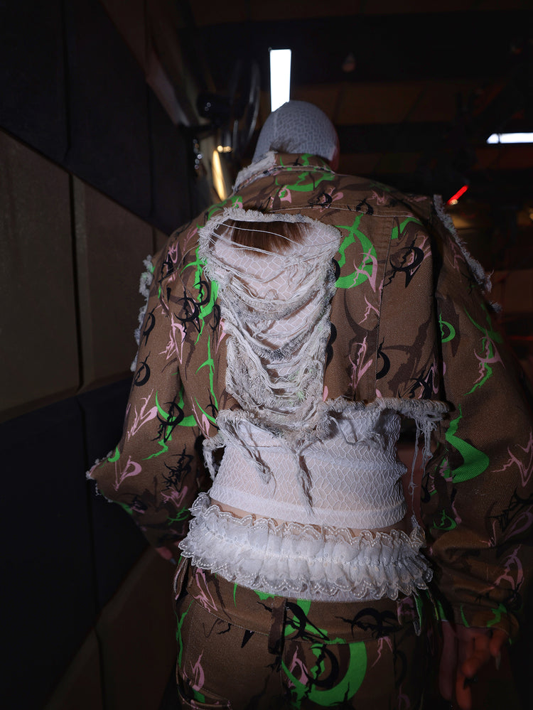 PINKSPINK ELECTRIC MOON distressed camo cropped jacket in CAMOUFLAGE — close rear view of the shredded back.