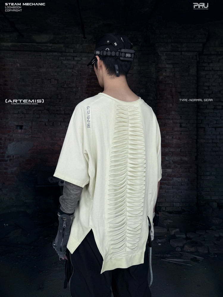 ERODED SPINE distressed asymmetric tee in aurora green — back modeled view showing the distressed spine panels