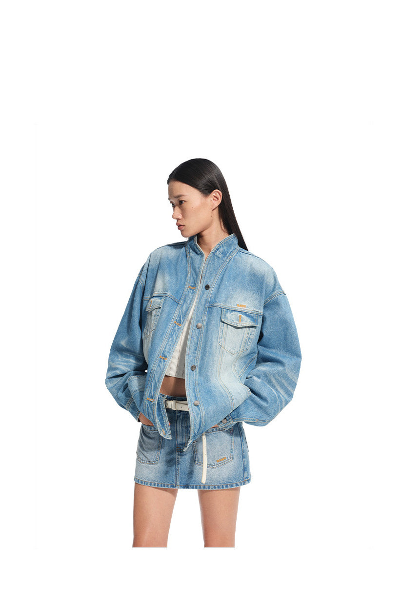 NAWS VOLCANO washed denim stand-collar jacket — modeled detail view of the garment construction